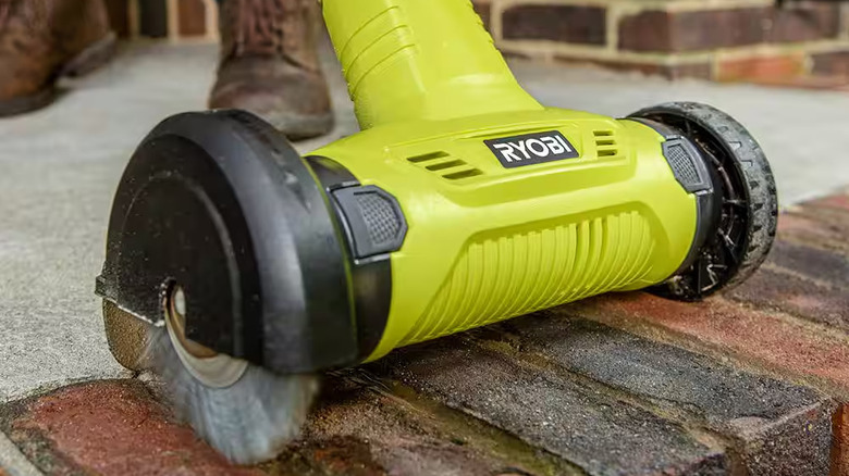 The Ryobi patio cleaner in action on brick steps