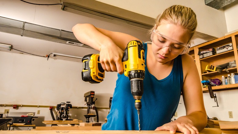 Woman using power drill