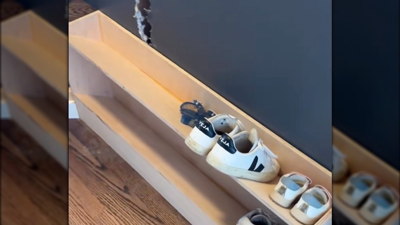 A custom made shoe rack with angled shelves