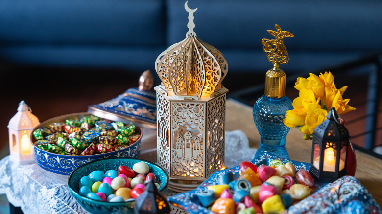Bowls of candy on table with Eid decorations