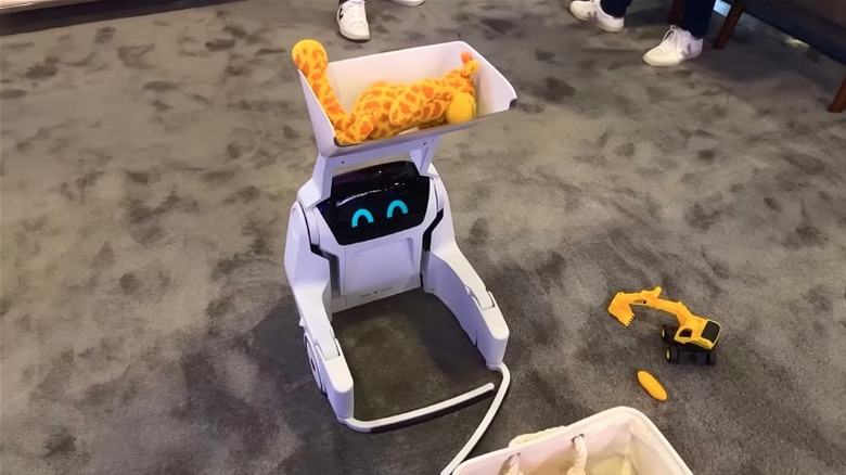 Clutterbot Rovie lifting children's toys at CES 2026