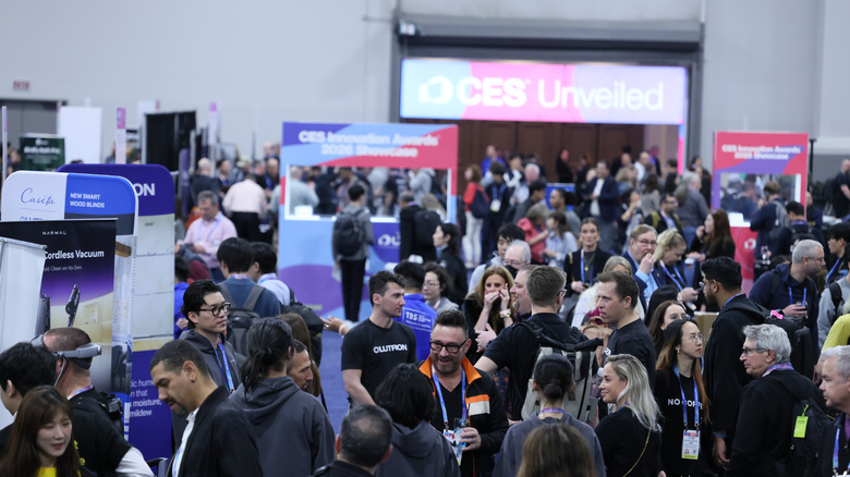 Convention attendees mill around at CES 2026.