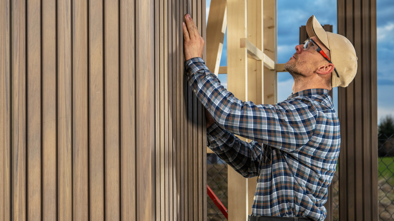 Man building a garden shed