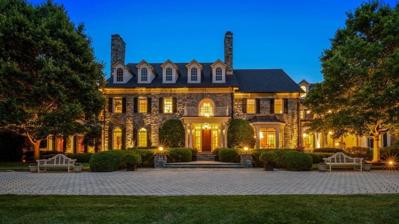 Stone mansion exterior at night