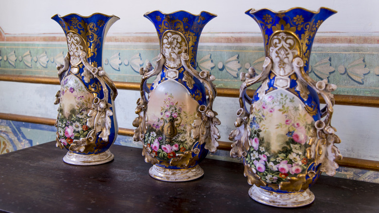 trio of blue and cream antique vases