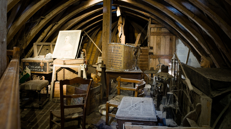 cluttered attic filled with miscellaneous items
