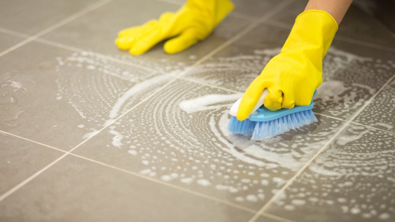 Person scrubbing the floor