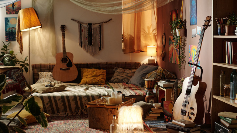 A bohemian living room is pleasantly cluttered with personal belongings.