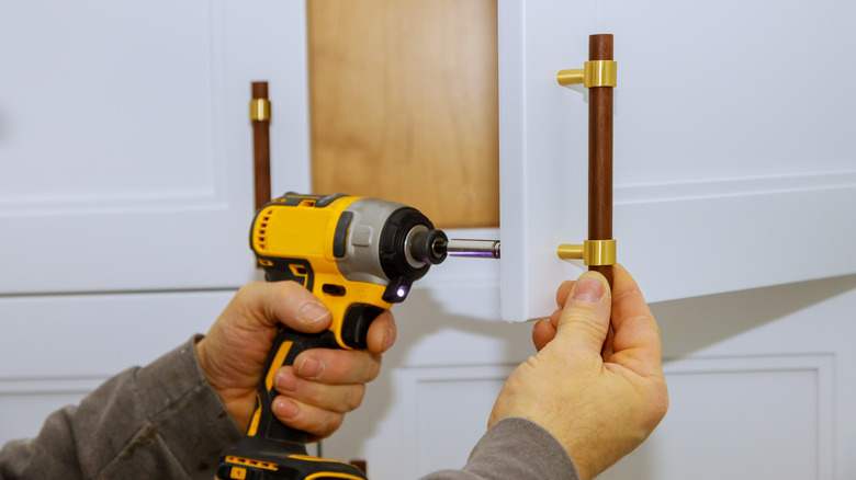 Installing pulls on kitchen cabinets