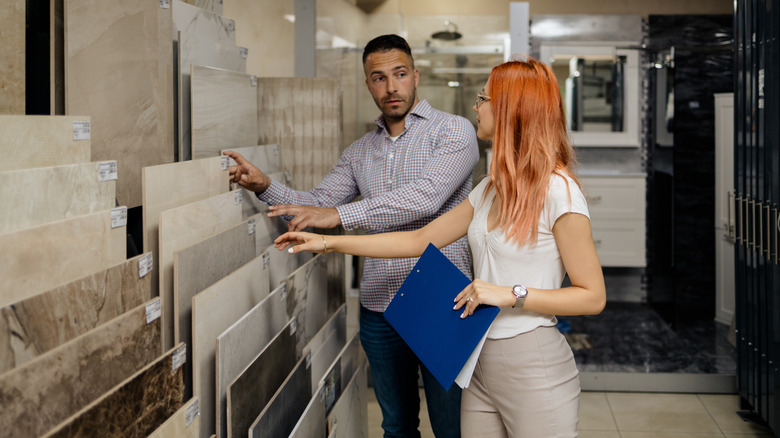 Man and woman choosing tile