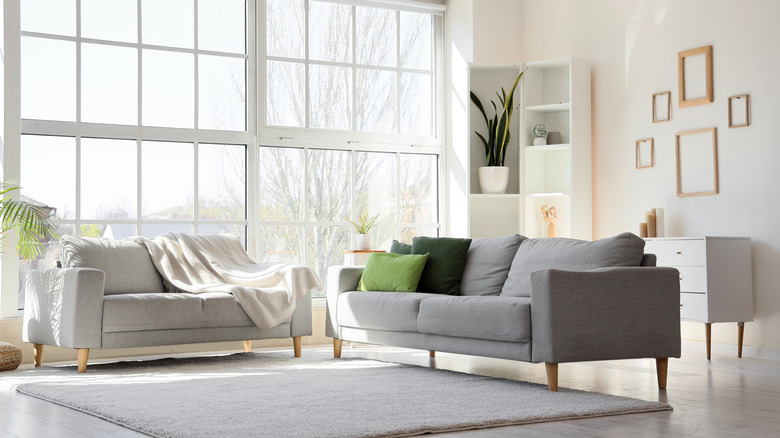 A living room with large windows.