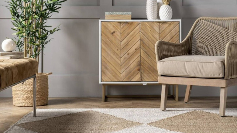 A living room with a jute rug.