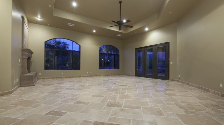 A room with travertine flooring.