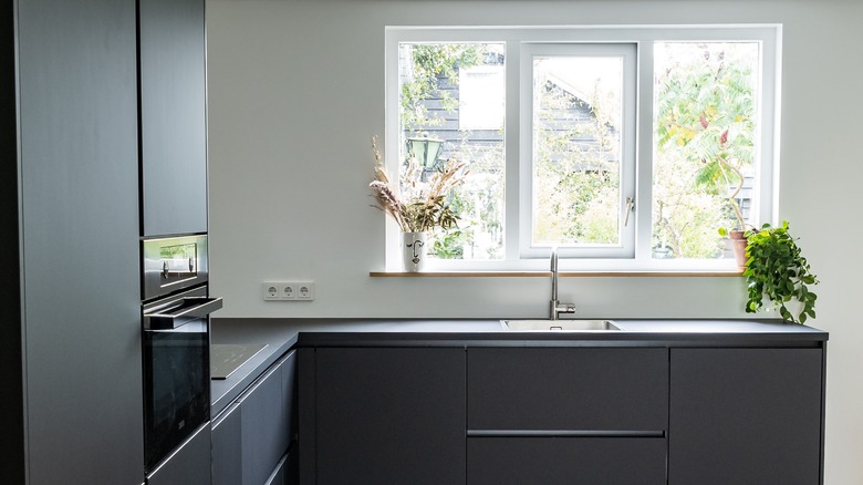 black kitchen with open window