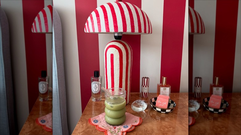 red and white stripped lamp and wall