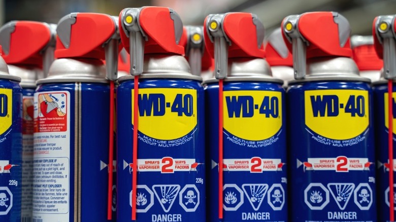 Close-up of WD-40 cans on store shelf