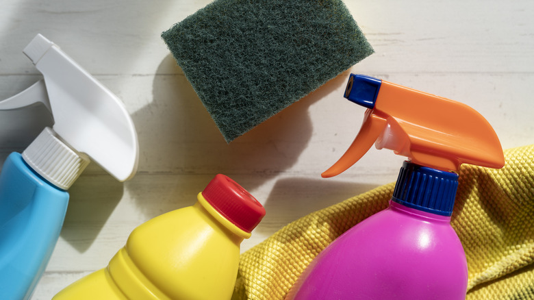 An assortment of cleaning supplies on a table
