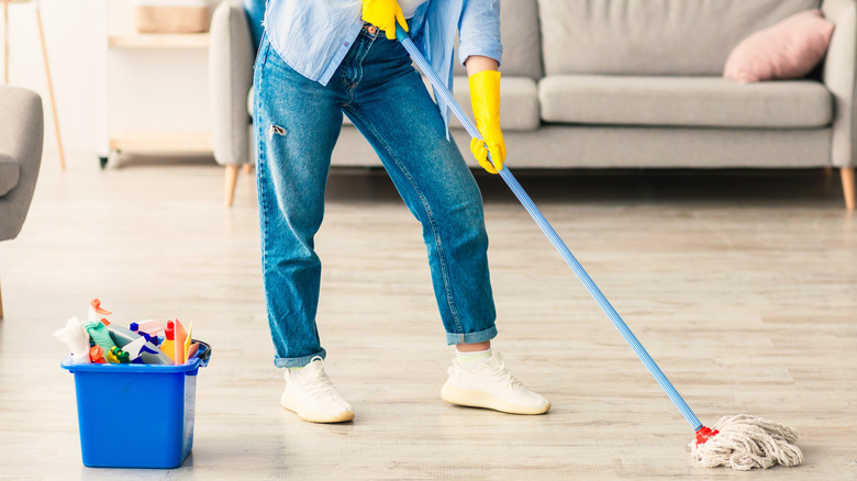 A person mopping laminate floors