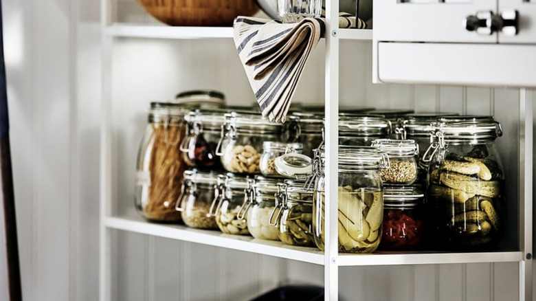 KORKEN Jars holding a variety of ingredients on a pantry shelf