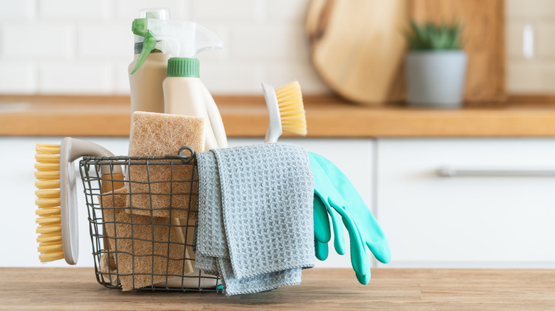 Basket with cleaning supplies