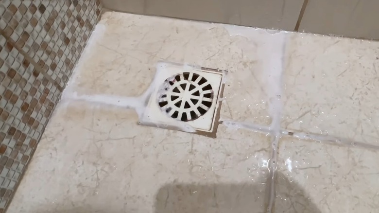 Hydrogen peroxide and salt solution on a shower floor
