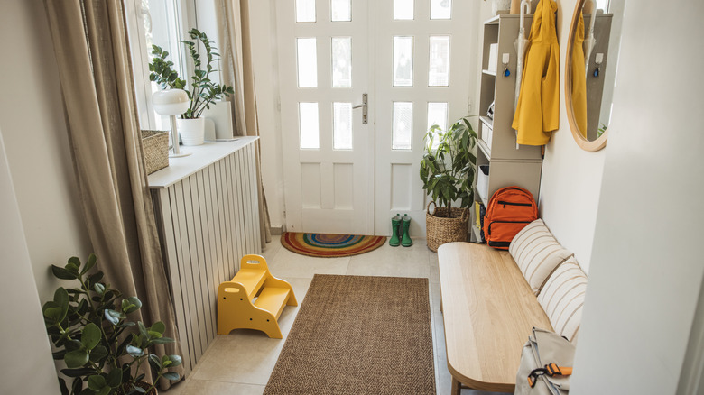 entryway of a home with a seating area