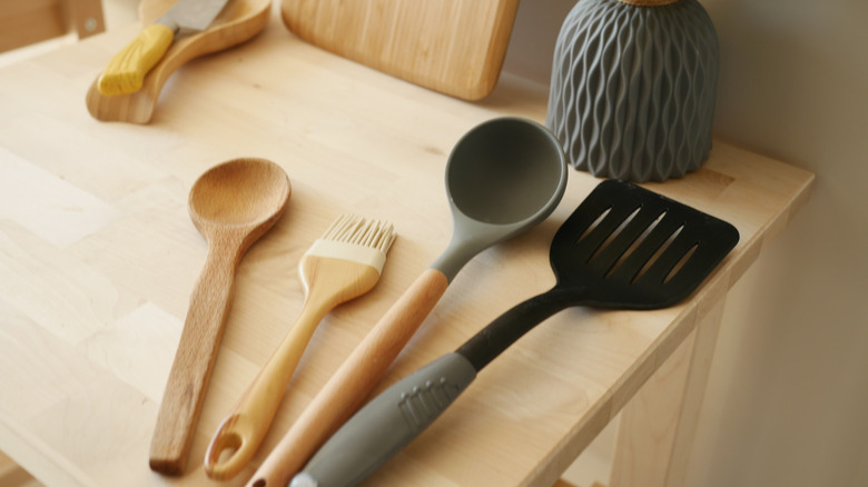 Kitchen utensils sitting on a counter