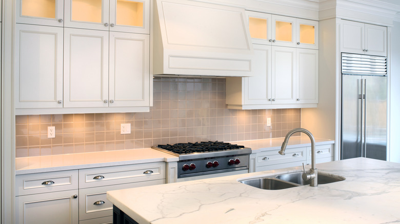 White kitchen with under-cabinet lights