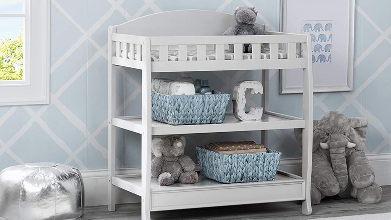 white changing table in nursery