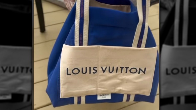 A DIY tote bag with a designer logo upcycled from a dust bag.