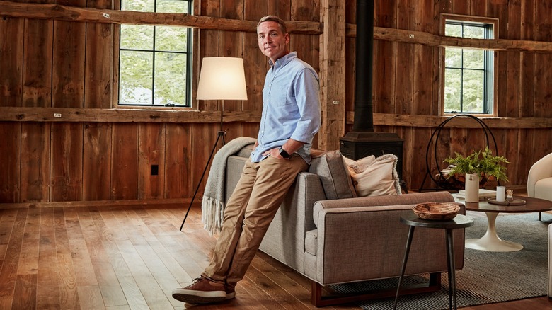 Clint Harp leaning on a sofa