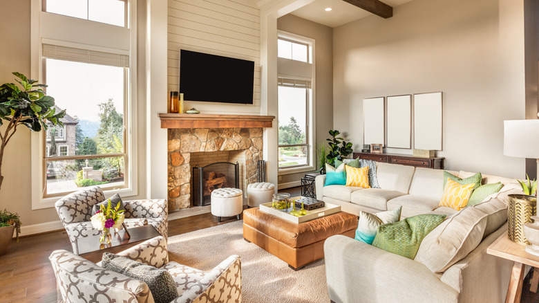 Traditional living room with minimalist mantel over masonry fireplace