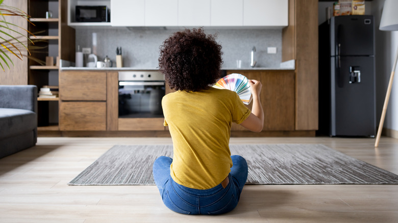 Woman picking paint swatches