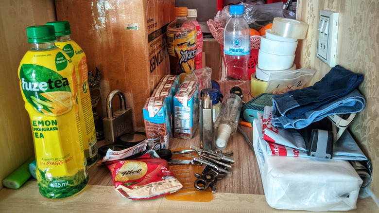 Messy kitchen with various loose items