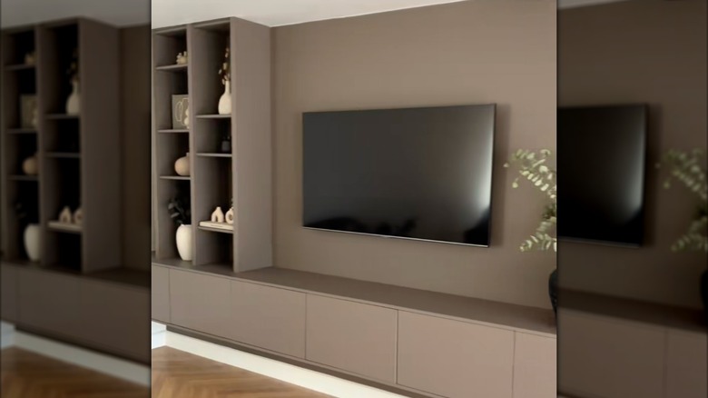 A custom TV unit made of IKEA furniture painted a brown color