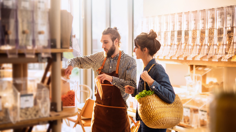 woman buying food in bulk