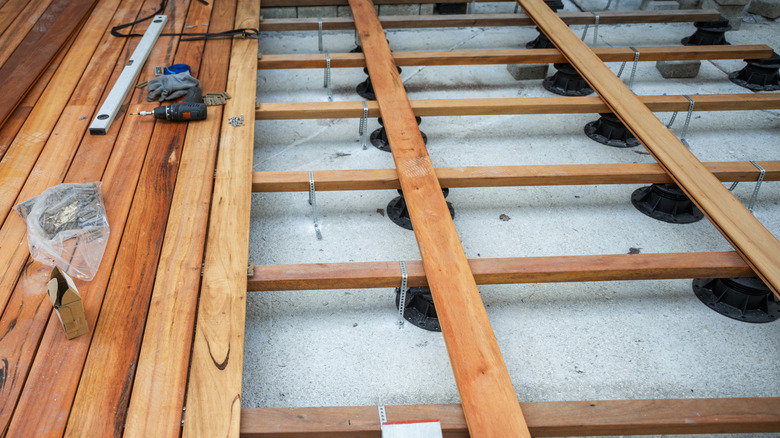 Internal joint spacing shown beneath wooden flooring