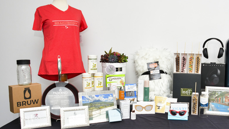 Table filled with promotional items from an event.