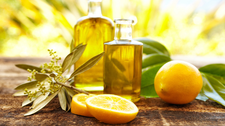 lemons with bottles of lemon oil