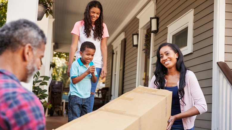 Family bringing furniture home