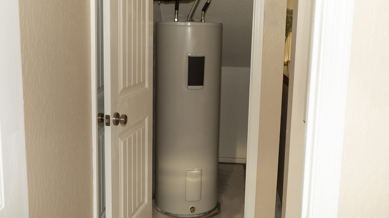 hot water heater in a storage closet of a home