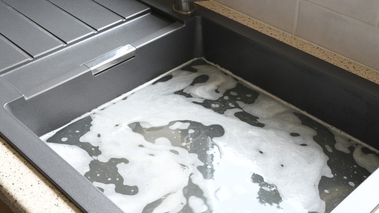 overflowing kitchen sink
