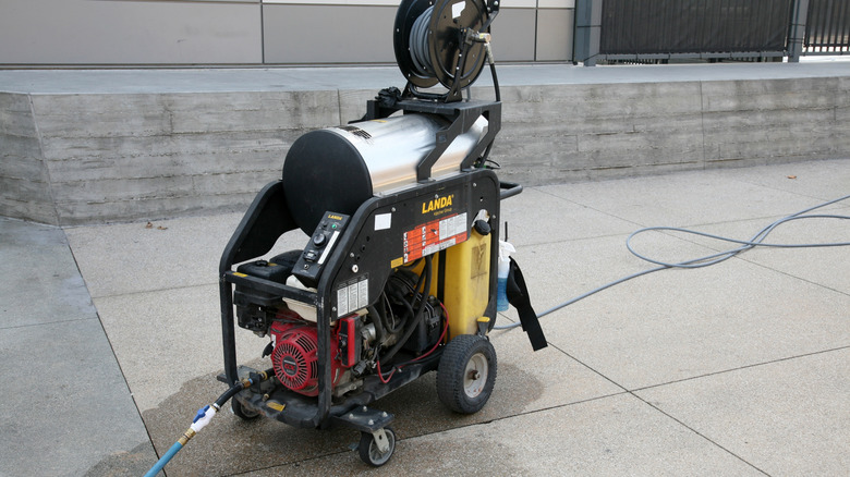 A pressure washer sitting outside of a home