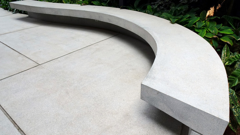 Concrete bench in modern backyard