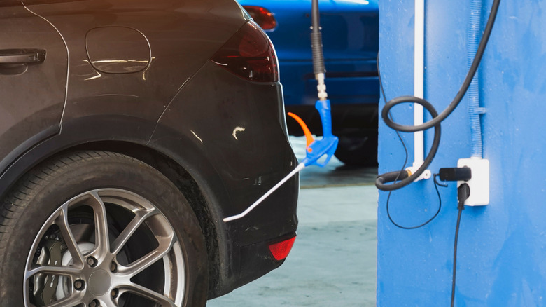 Multiple cords plugged into a garage outlet