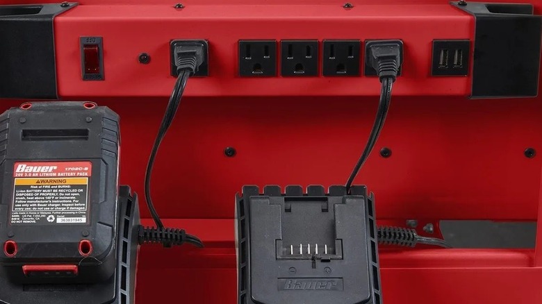 Battery chargers plugged into a U.S. General power strip