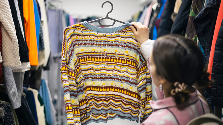 Person thrift shopping