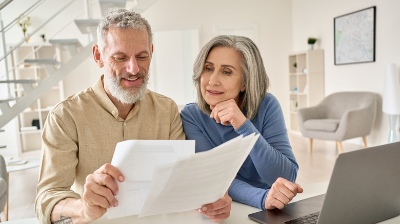 couple looking over insurance policy