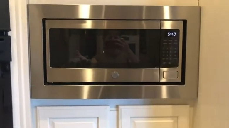 GE microwave mounted on wall