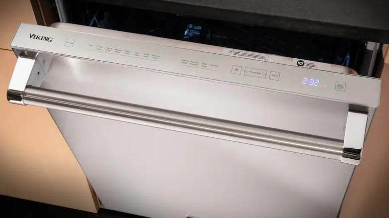 A Viking dishwasher partially opened with the label on top